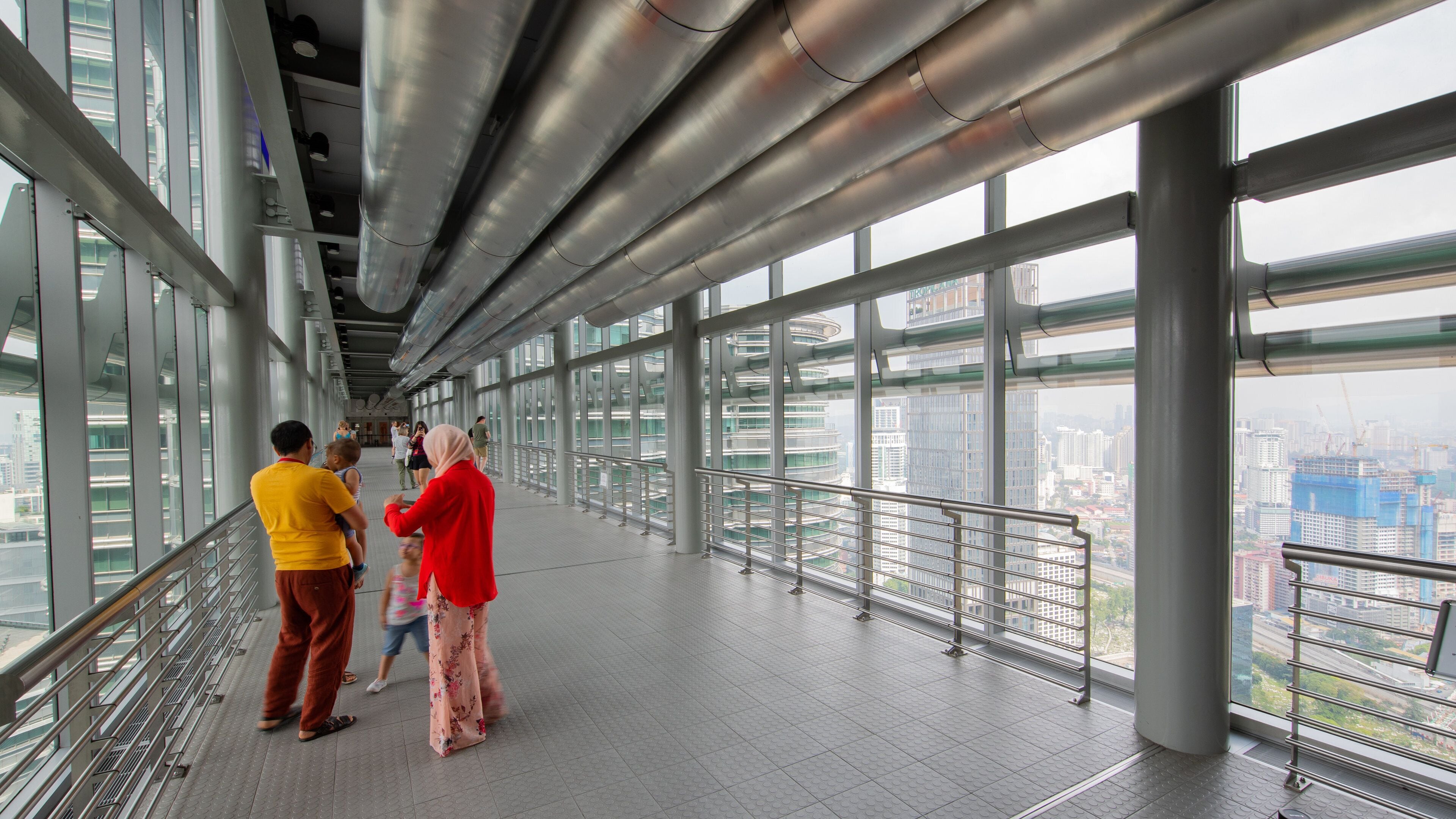 Petronas Twin Towers showing interior views as well as a small group of people