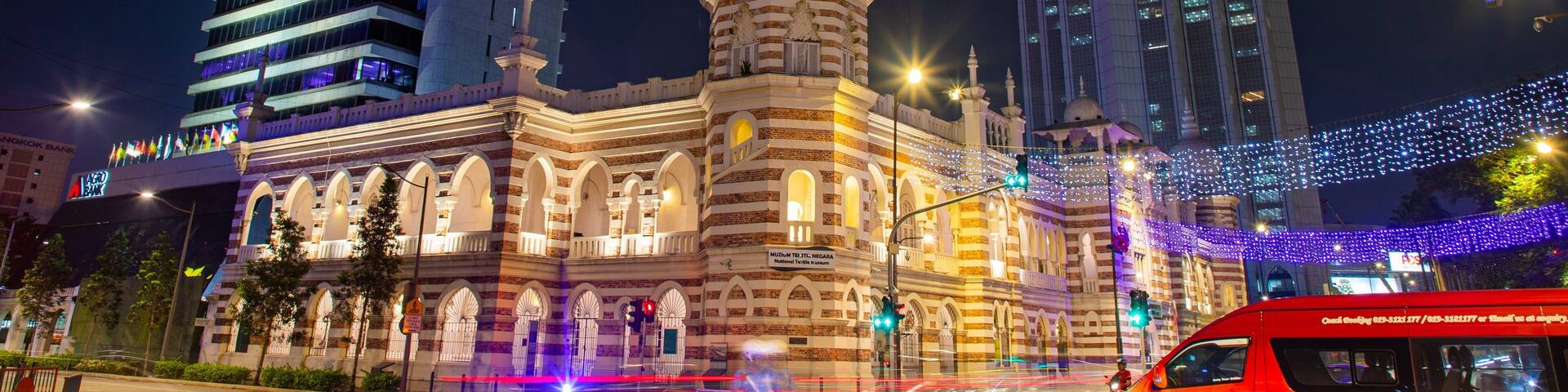 Merdeka Square featuring night scenes, a city and heritage architecture