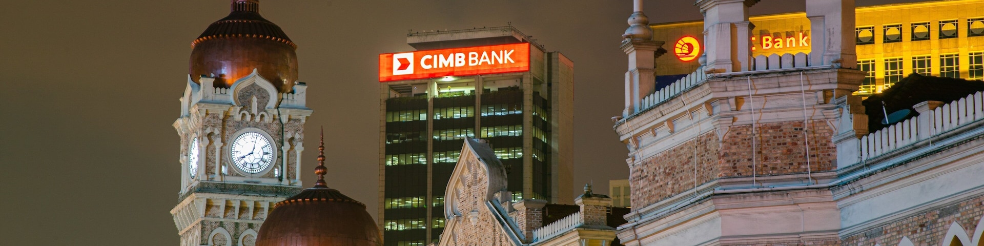 Merdeka Square which includes night scenes, heritage elements and a city