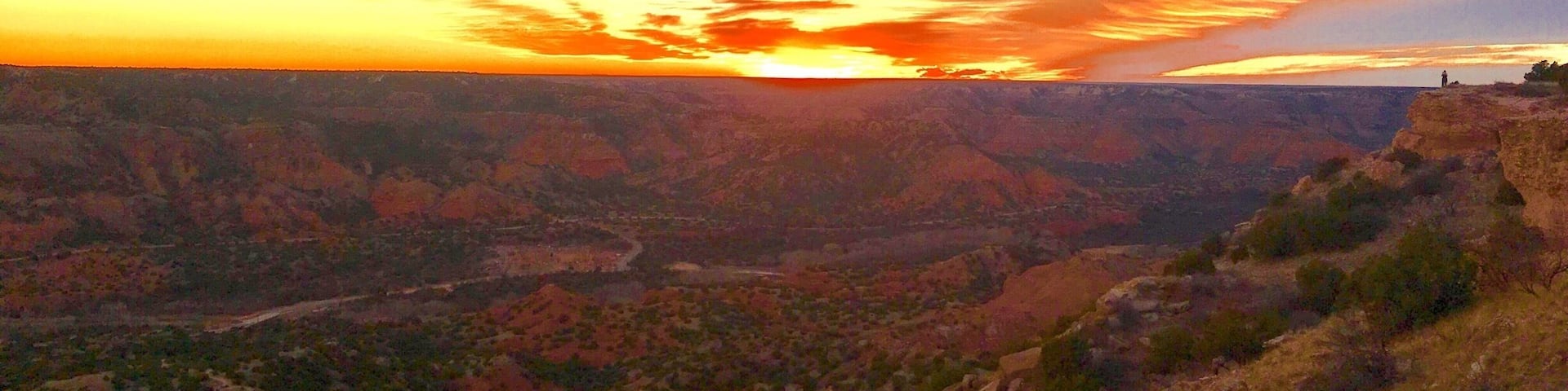 A canyon landscape with a sunset.