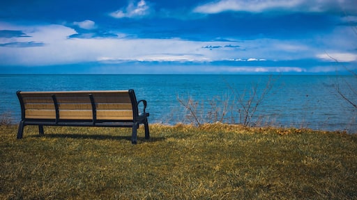 An empty bench overlooking Lake Erie in Geneva-On-The-Lake, Ohio
