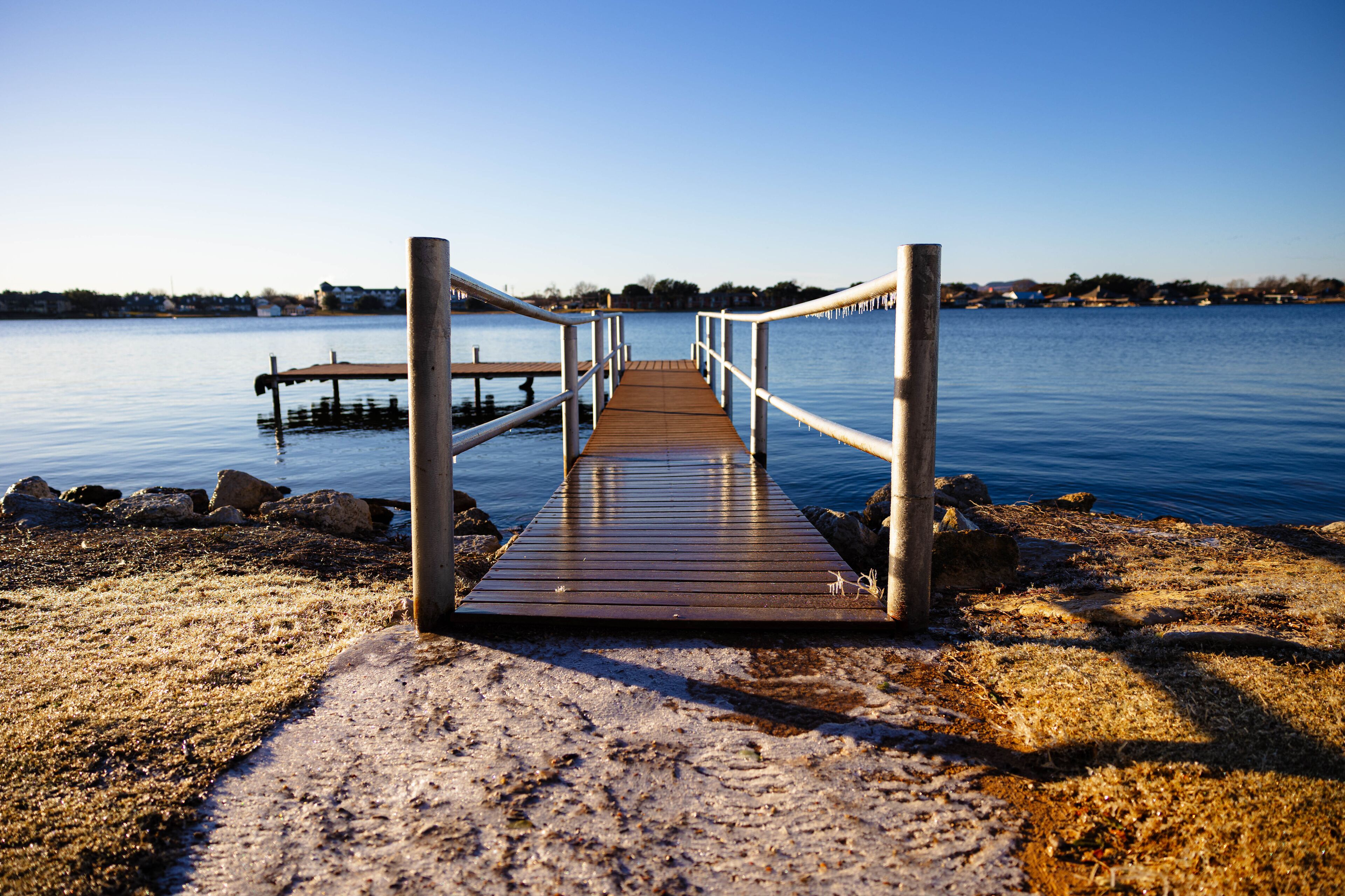 Dock on a cold morning at Lake Granbury at a small beach near the downtown square
