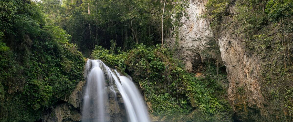 waterfall in the jungle, vivid, turquoise-blue water and lush jungle surroundings, Kawasan Falls, Badian, Cebu, the Philippines