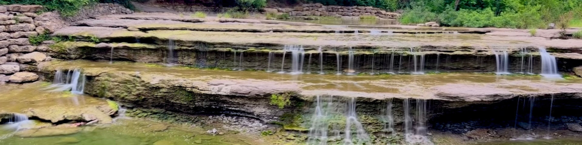 Airfield Falls Trailhead and Conservation Park where you'll find Tarrant County's largest natural waterfall.