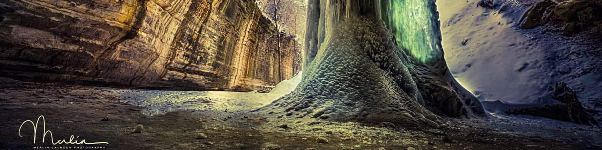 Frozen waterfall in Ottawa canyon at Starved Rock state park. The algae trapped in the ice causes a green glow when the sun shines through it.