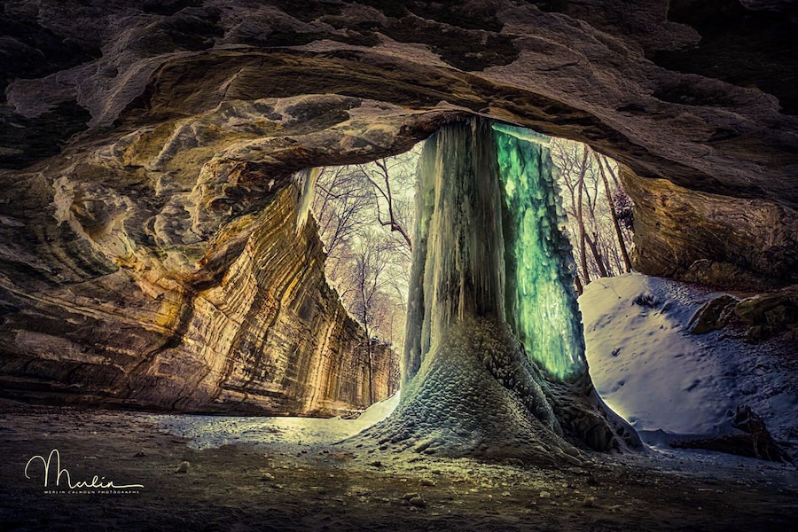 Frozen waterfall in Ottawa canyon at Starved Rock state park. The algae trapped in the ice causes a green glow when the sun shines through it.