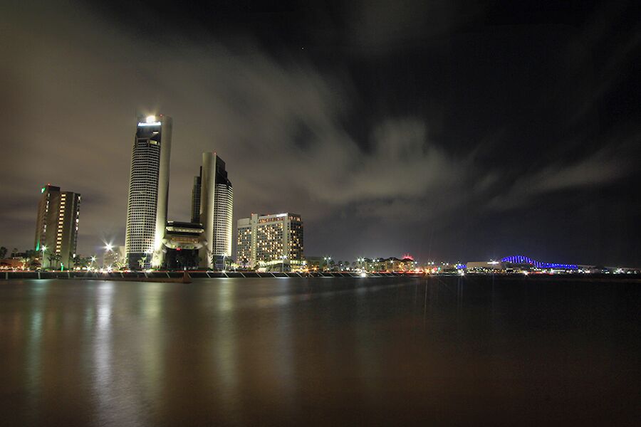 High winds equaled choppy water and fast moving clouds to frame downtown Corpus Christi.  I decided to emphasize both using a slow shutter.
#cityscape #night #texas #beach #corpuschristi
