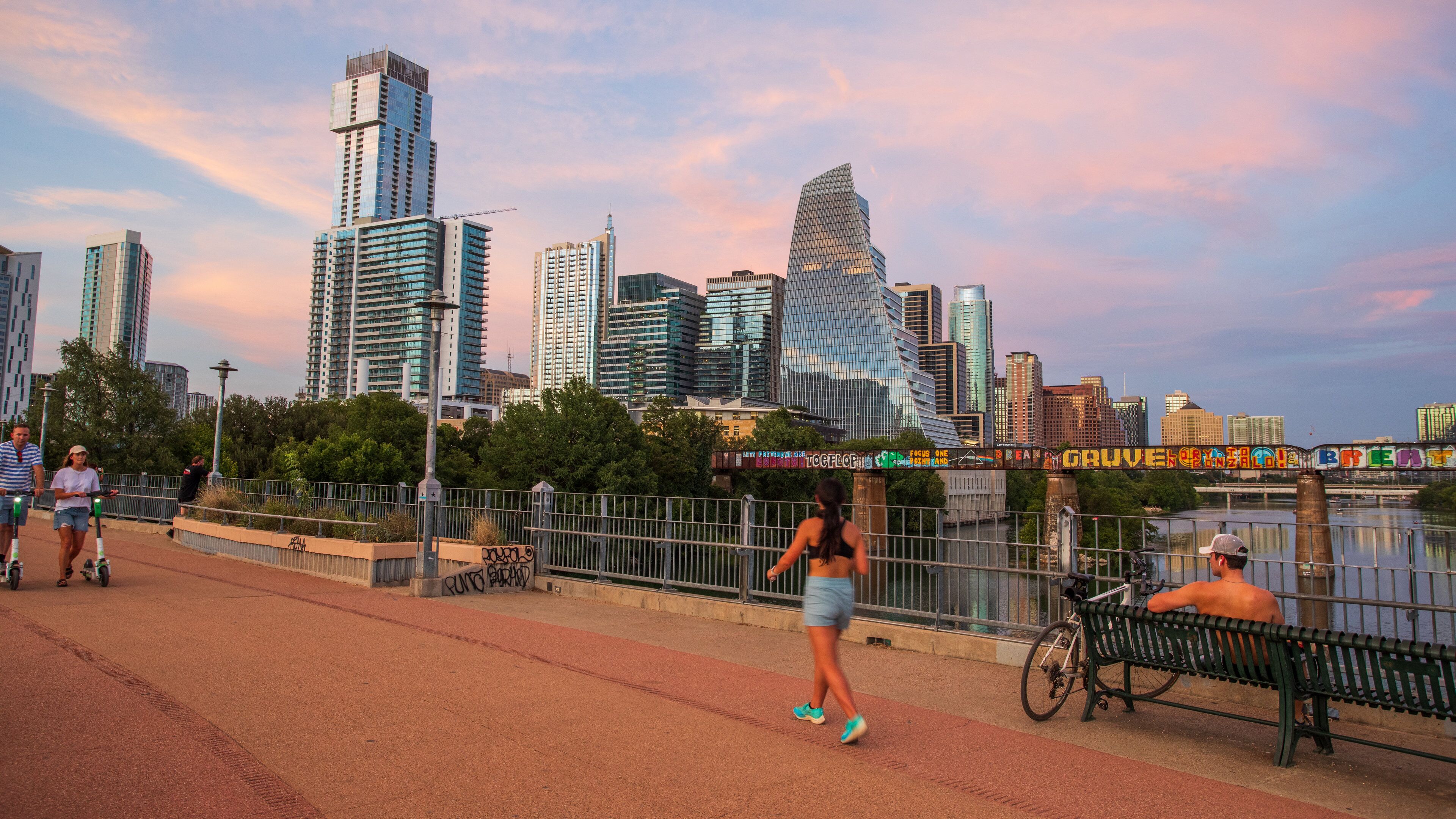 Downtown Austin showing street scenes, a sunset and a city