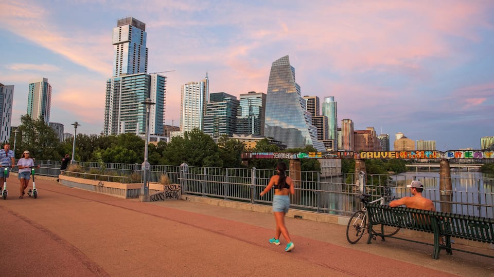 Downtown Austin showing street scenes, a sunset and a city