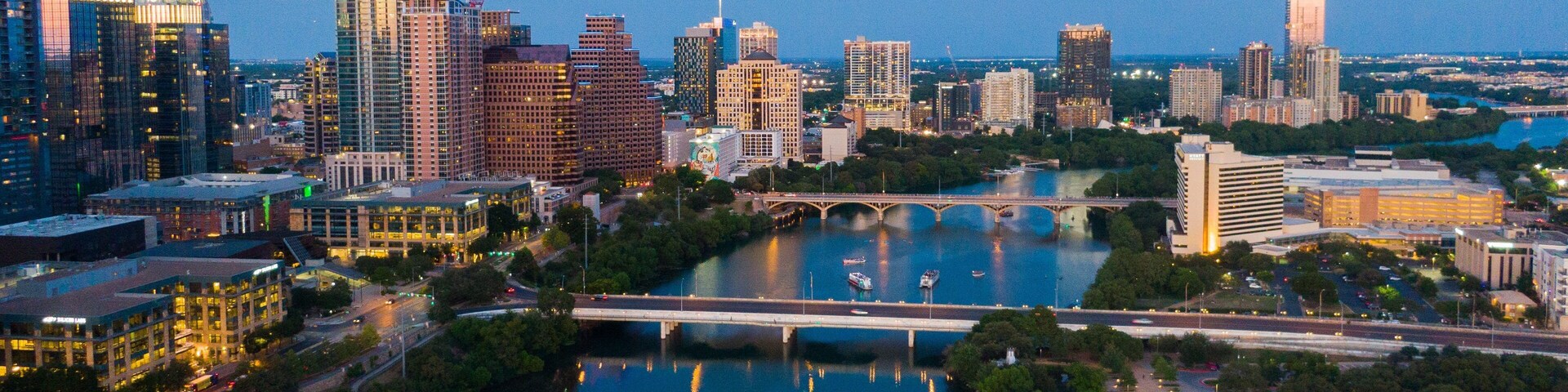 Downtown Austin showing night scenes, landscape views and a city