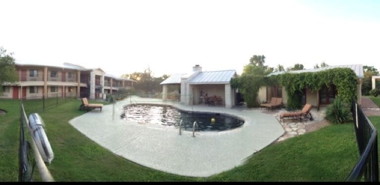 Under a bill, 2 pools, one being volleyball,hot tub, waterslide, WASHERS (the Texas game), outdoor tv/fireplace, awesome patio furniture, FREE BREAKFAST, walking distance to main.  