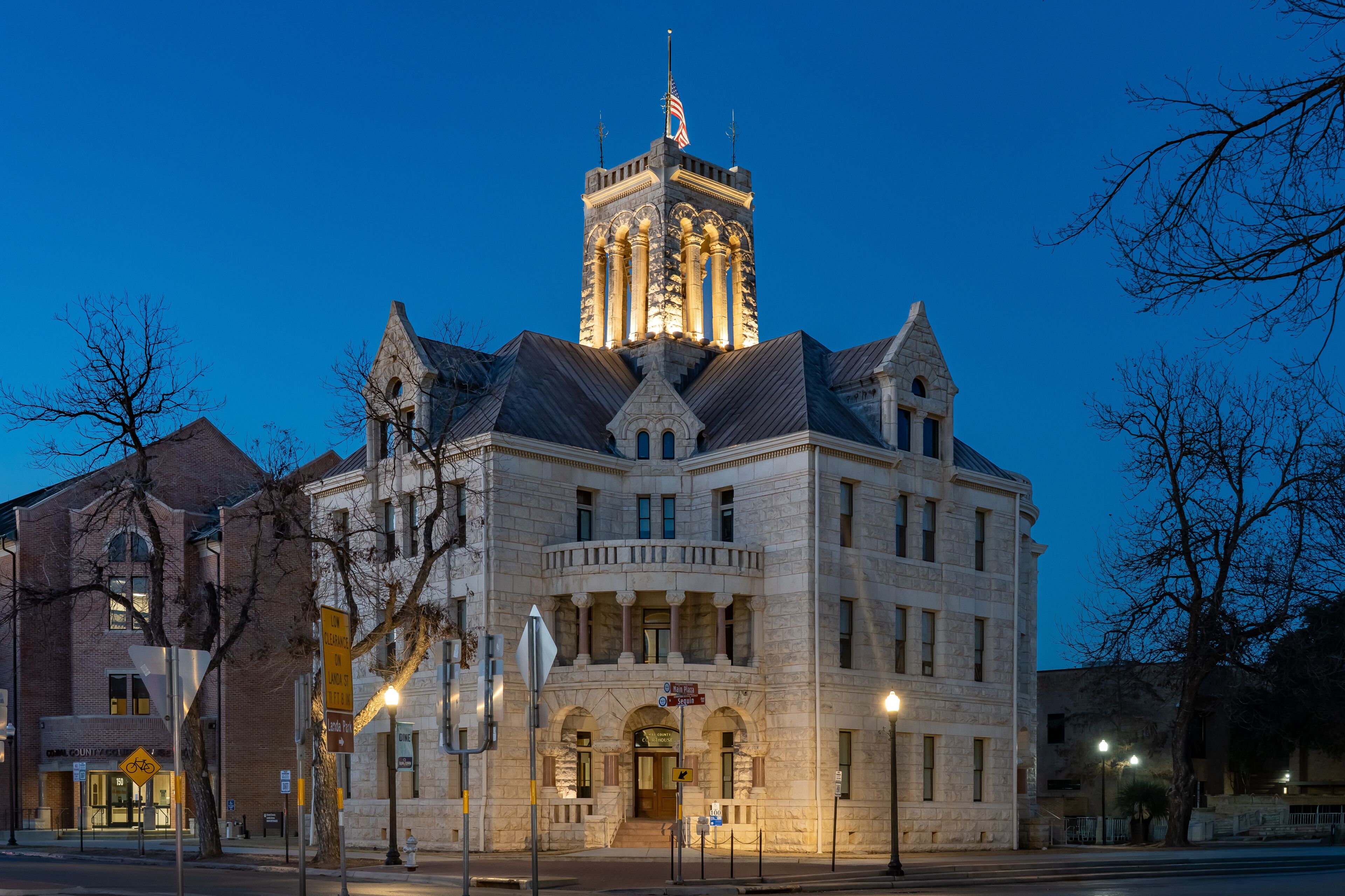 A historic building with a clock tower and a large arched entrance.