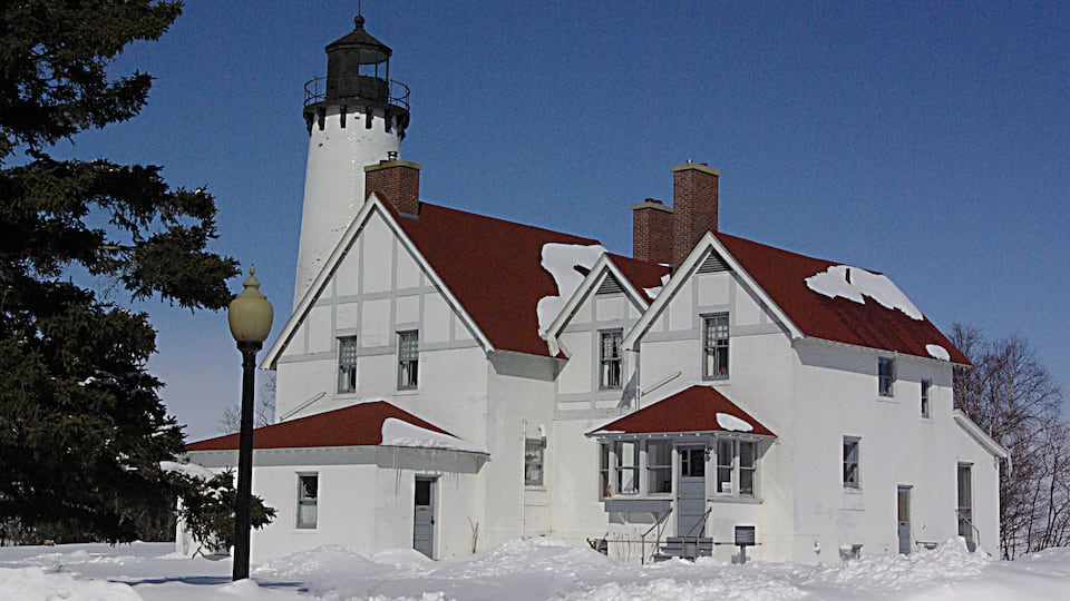 Winter in Michigan.
The Upper Peninsula is a forested region in Michigan bordering 3 of the Great Lakes and extending outward from Wisconsin. It’s connected to Michigan’s Lower Peninsula by the roughly 5-miles-long Mackinac Bridge, which spans the Straits of Mackinac. Sandwiched between the 2 peninsulas is Mackinac Island, a car-free vacation destination with the iconic 1887 Grand Hotel and the Victorian-era Fort Mackinac.