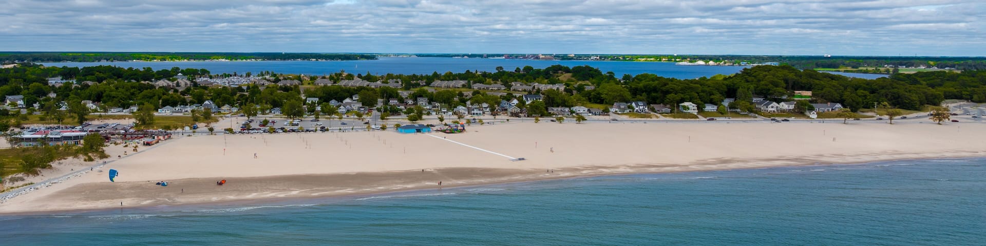 Aerial Drone View of Muskegon and Norton Shores Michigan Over Lake Michigan Coastline 2025