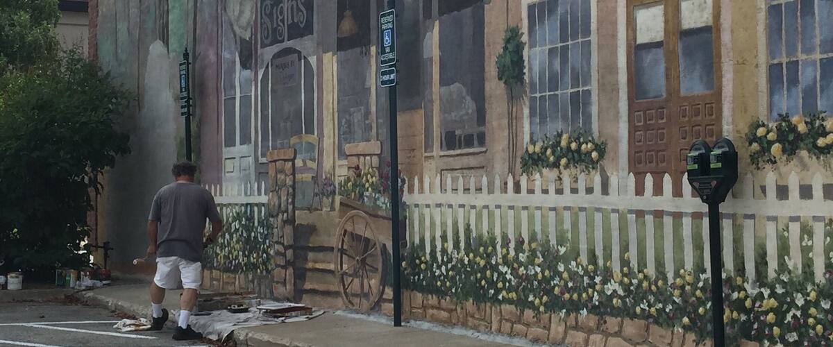 While I was in Petoskey Michigan I got to see a man finishing up a beautiful mural that was about a block long.