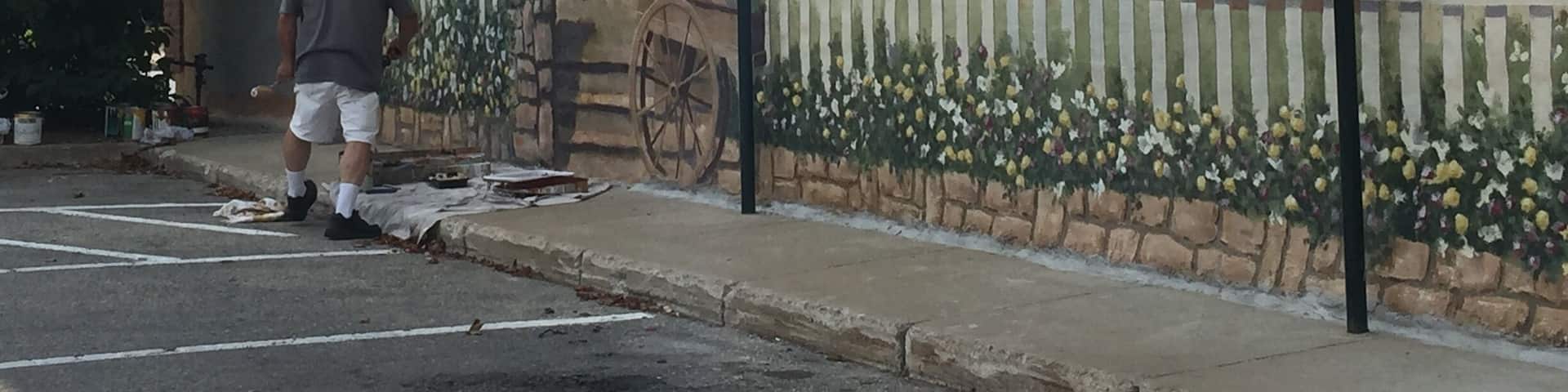While I was in Petoskey Michigan I got to see a man finishing up a beautiful mural that was about a block long.