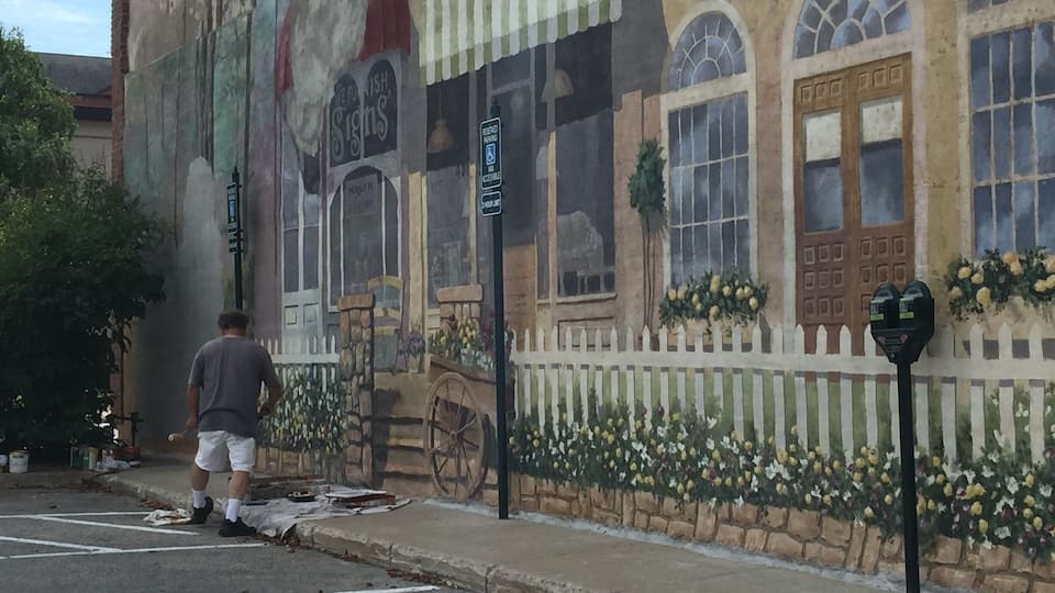 While I was in Petoskey Michigan I got to see a man finishing up a beautiful mural that was about a block long.