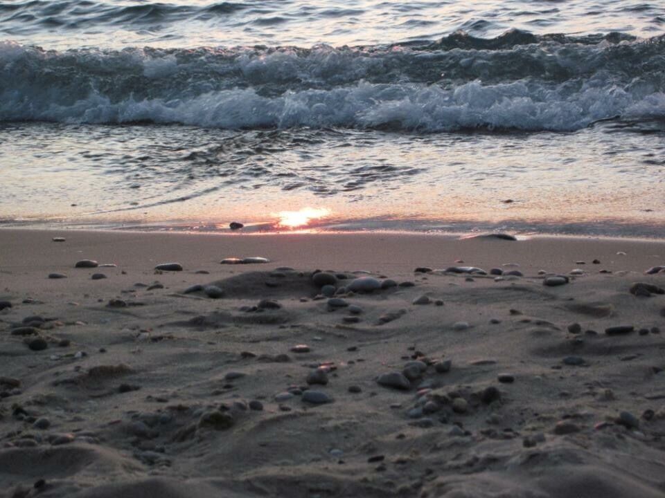 A sunset on the waters of Lake Michigan in beautiful Petoskey, MI where many of the fossilized Petoskey stones can be found. 