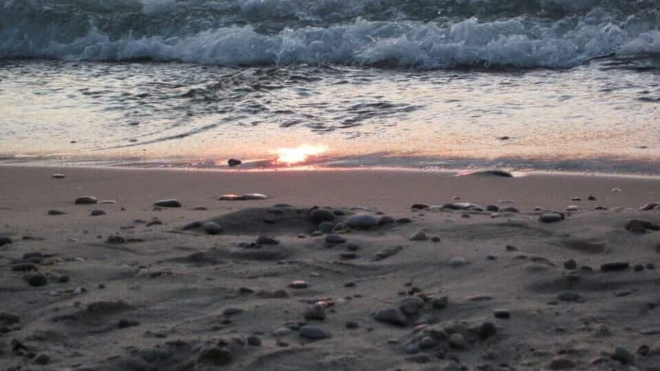 A sunset on the waters of Lake Michigan in beautiful Petoskey, MI where many of the fossilized Petoskey stones can be found.