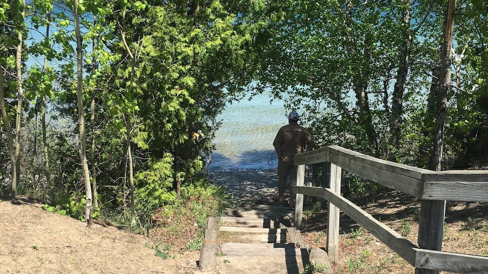 Stairway by the side of the road that touches Lake Michigan.