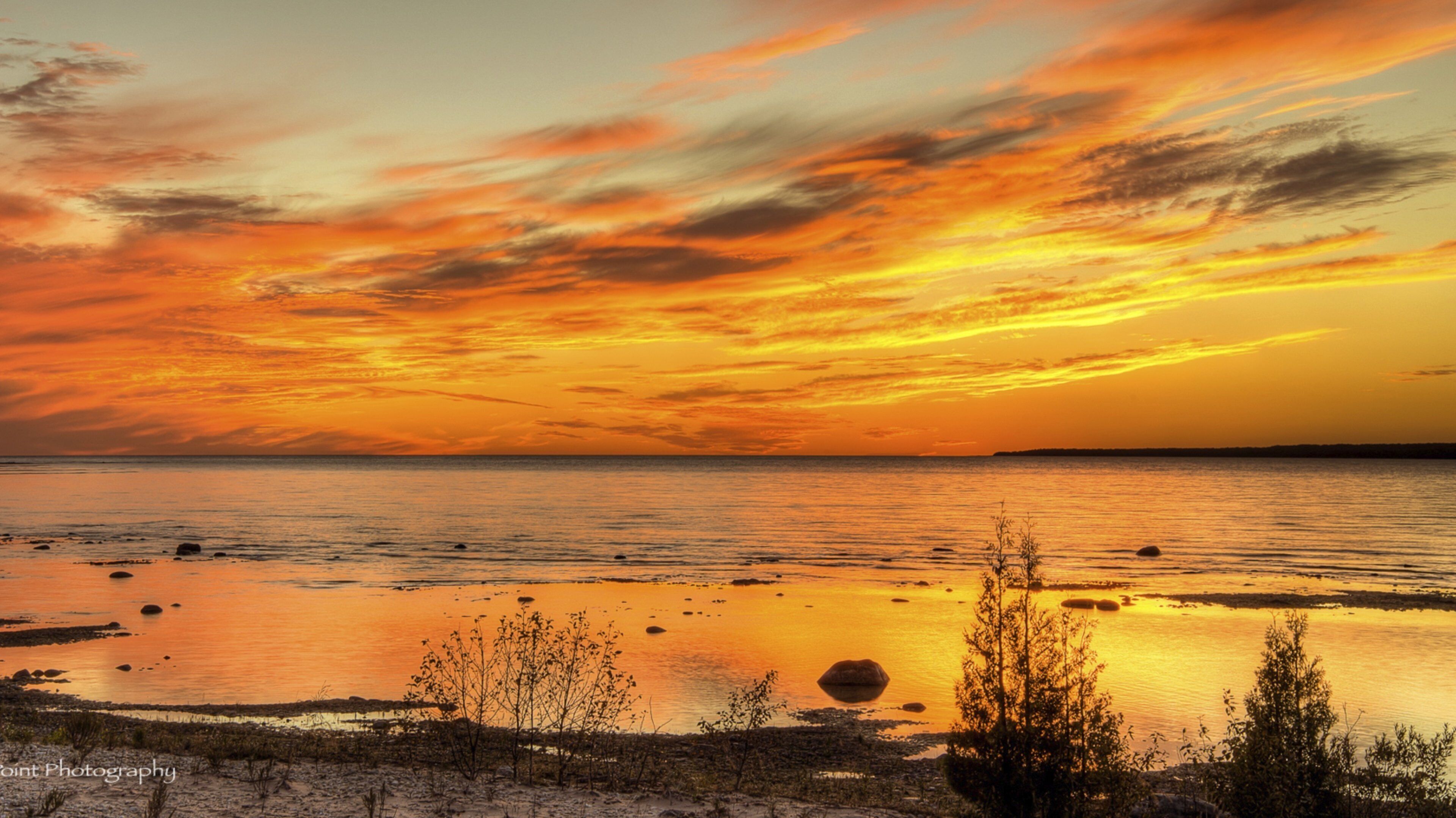 Ile de Beaver mettant en vedette plage de sable, vues littorales et coucher de soleil