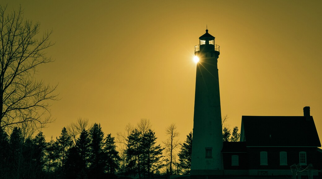 The Light Shines On. The Tawas Point Lighthouse encased in the light of the setting sun. Tawas State Park. Tawas City, Michigan.