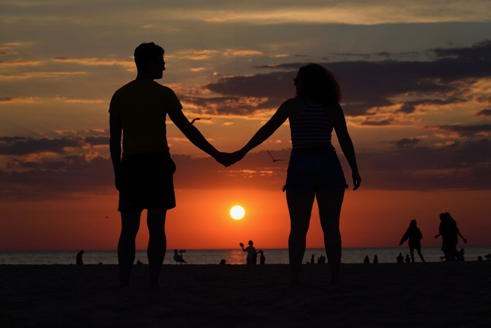 A beautiful golden expanse of beach in Michigan. Photographers will love the sand dunes and pier too - tons to photograph. We arrived at the beach just before sunset and there were still plenty of people enjoying the evening sun. #golden