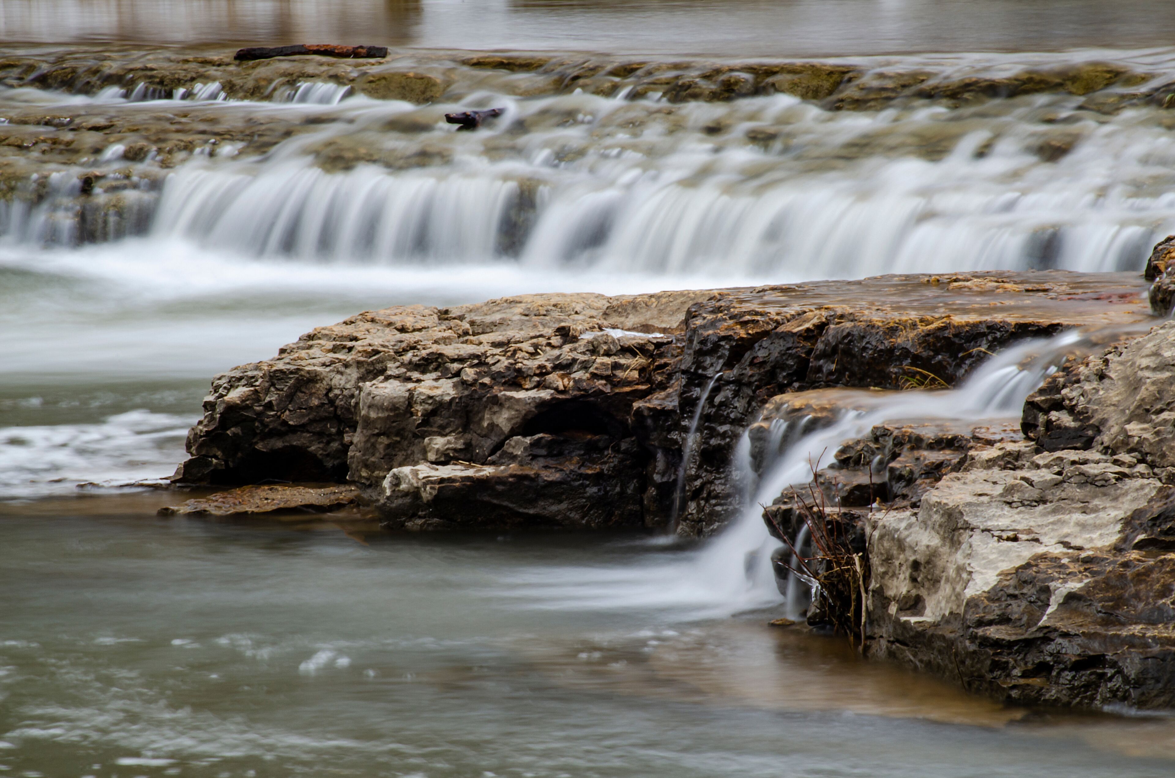 A waterfall cascading over rocky terrain.