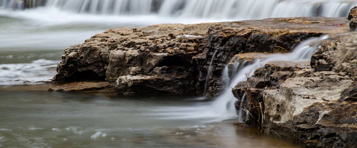 A waterfall cascading over rocky terrain.