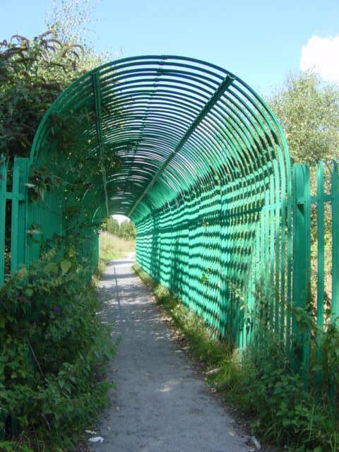 Footbridge over Liverpool-Manchester Railway. An unusual view of the footbridge over Liverpool-Manchester railway line at Hunts Cross near the Halewood Triangle Country Park.