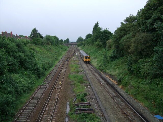 Hunts Cross, all change Merseyrail train approaching Hunts Cross station from Southport. The two lines on the left are from Liverpool Lime Street via the chord at Liverpool South Parkway (Allerton Junction) and continue (behind the photographer) to Manchester.