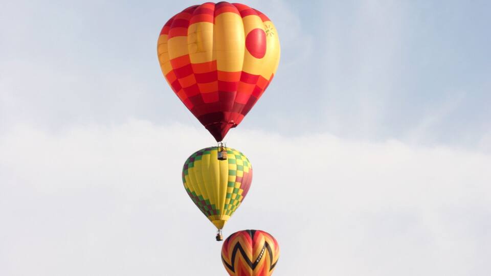Three hot air balloons in the sky.