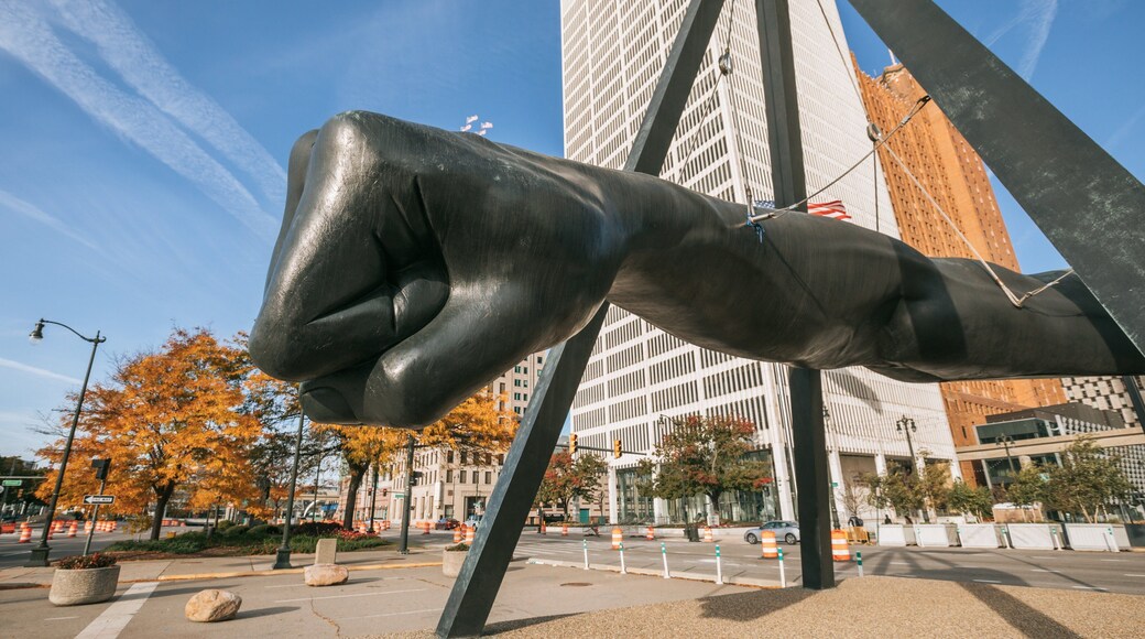 Downtown Detroit featuring outdoor art and a statue or sculpture