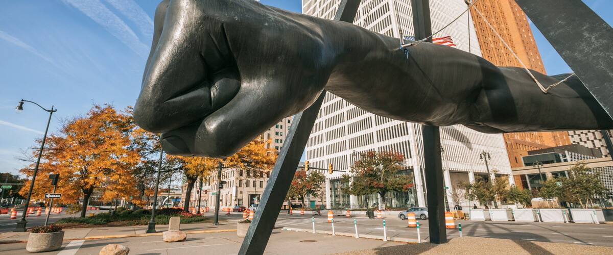 Downtown Detroit featuring outdoor art and a statue or sculpture