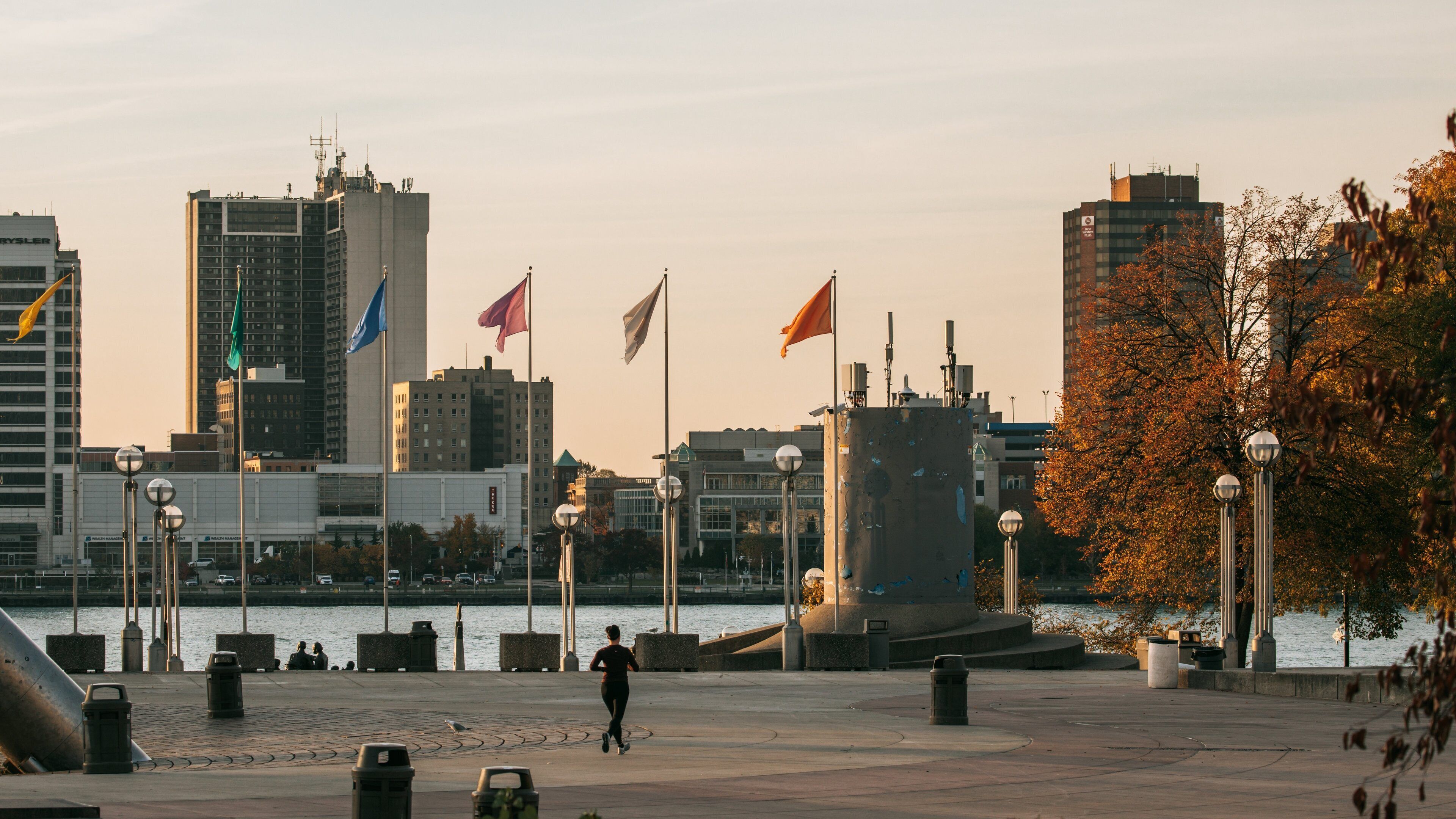 Downtown Detroit showing a square or plaza, a sunset and a city