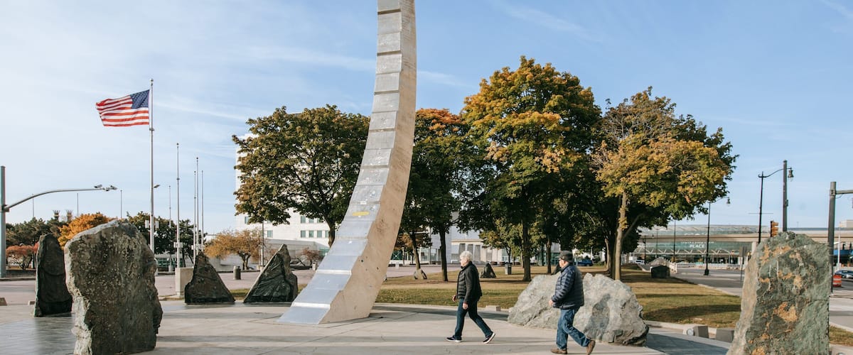Downtown Detroit featuring a park as well as a couple