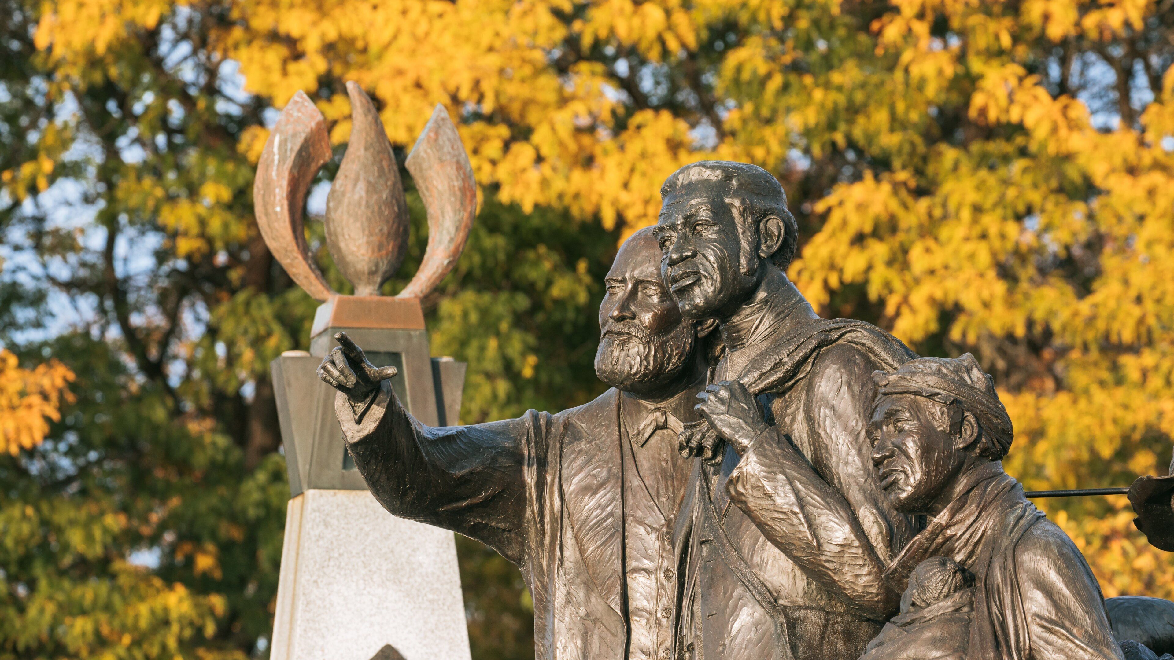 Downtown Detroit featuring a statue or sculpture