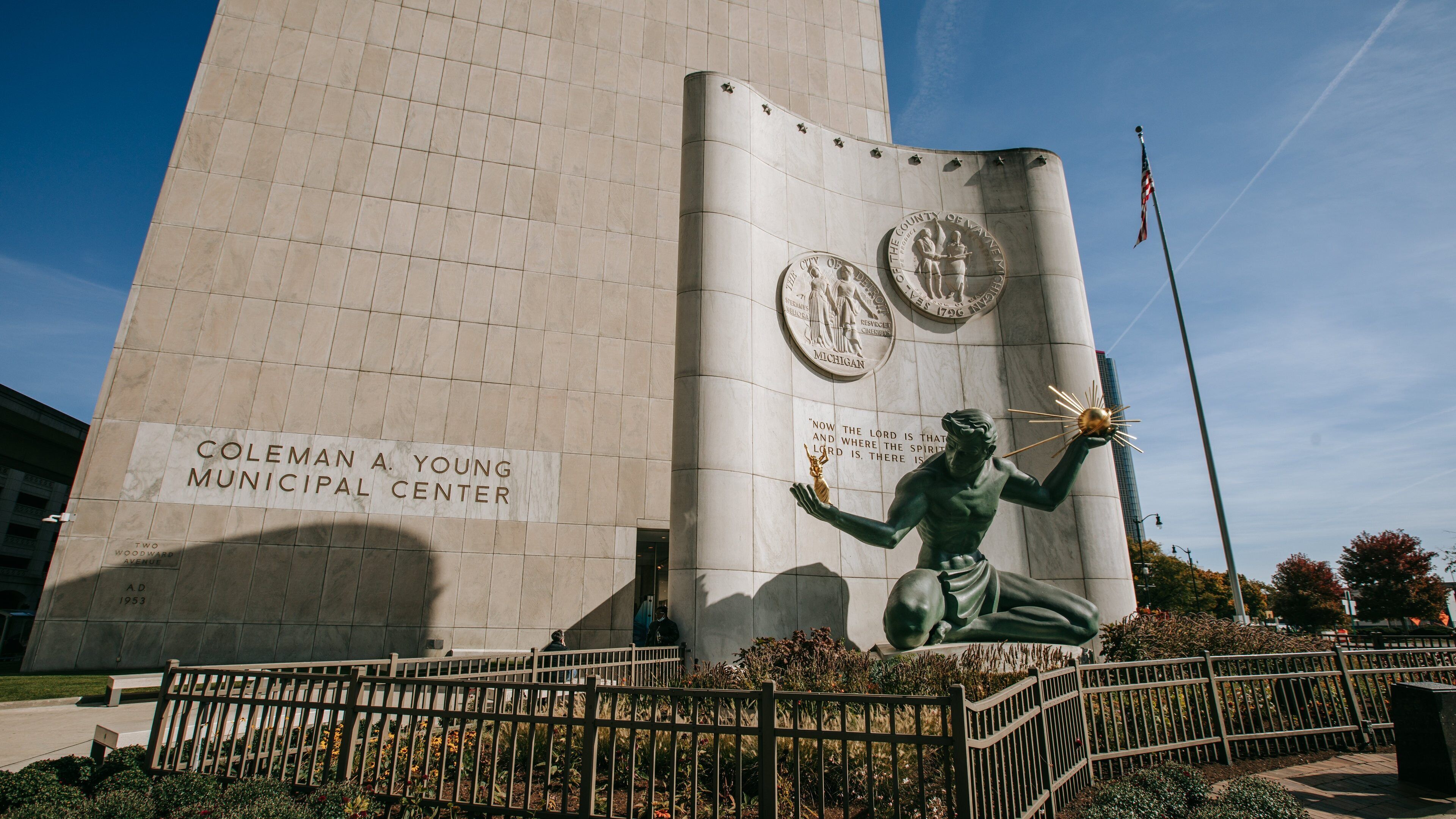 Downtown Detroit featuring a statue or sculpture