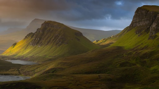 Dramatic mountains of the Isle of Skye seen from viewpoint on the Quiraing. Large panorama with dark moody clouds. Scotland landscapes, Inner Hebrides, UK.