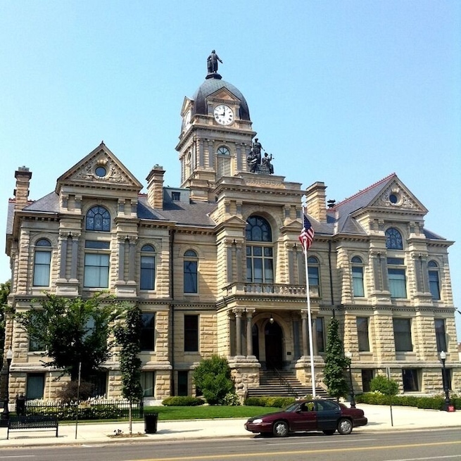 Historic courthouse completed in 1888 amid Findlay's gas boom years. The courthouse cost $500,000, an enormous sum, particularly so given Findlay's population at the time was only 20,000 people.
The courthouse features an 18' copper statue of John Hancock atop the clock tower. Inside you'll find ornately tiled floors, lovely stained glass windows and early Victorian woodwork.