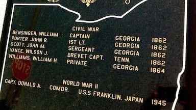 Congressional Medal of Honor plaque just outside the courthouse. Three of these men were members of a small Union Army party to penetrate 200 miles into the South and capture an enemy train in an attempt to destroy bridges and track between Chattanooga and Atlanta.