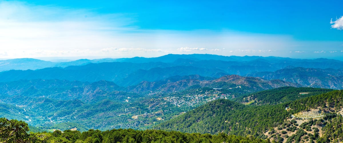A mountainous landscape with a town nestled in the valley.