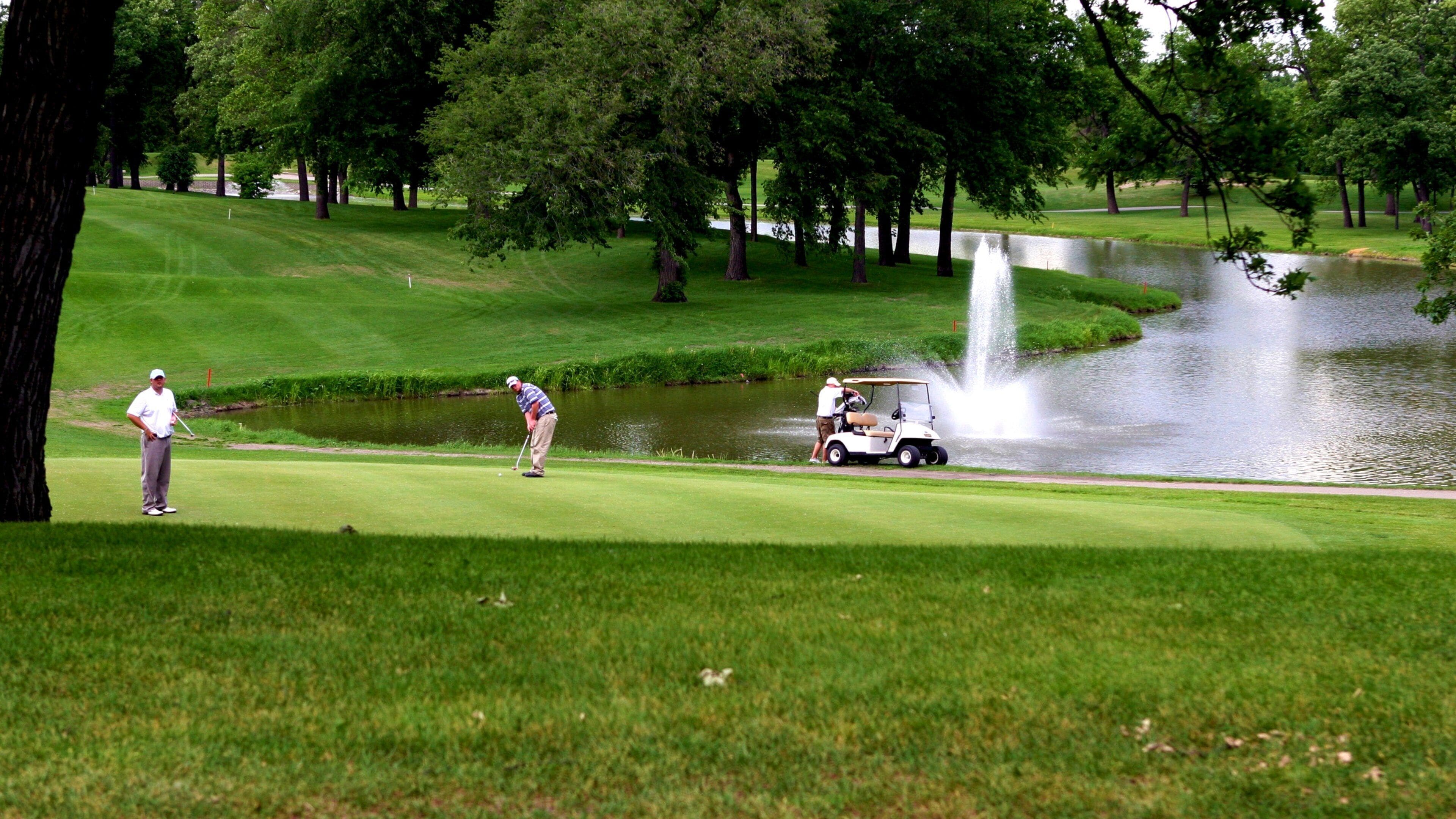 Fargo which includes a fountain, a pond and golf