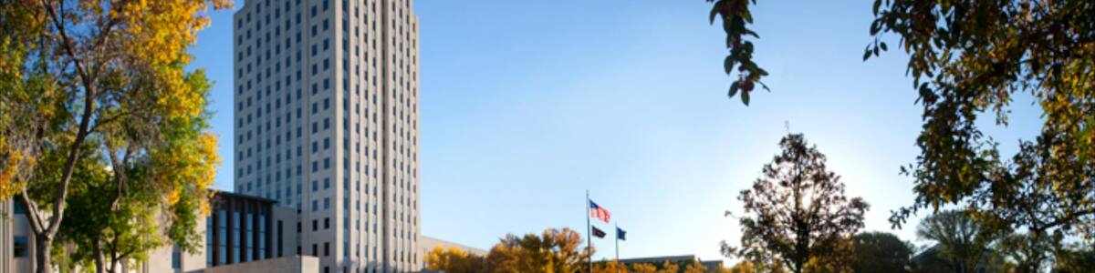 Bismarck showing modern architecture, a high rise building and a park