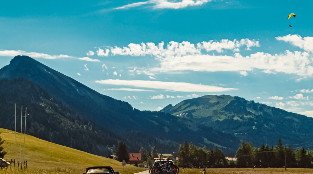 Beautiful alpine summer view with paragliders at the famous Tannheimer Tal valley, Graen, Tyrol, Austria
