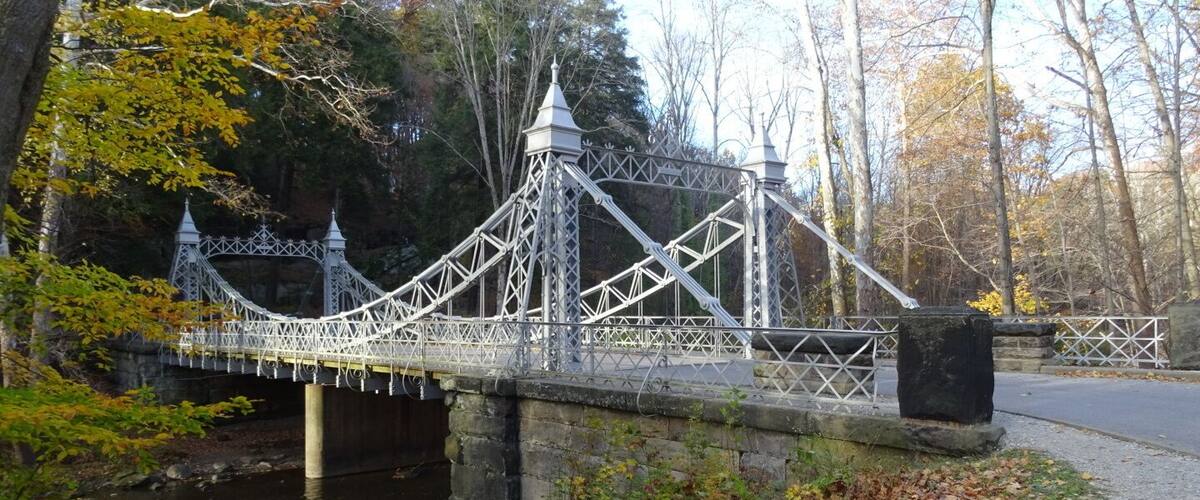The bridge linking the east and west parts of the trail.
The Gorge Trail is a breathtakingly beautiful two-mile loop along Mill Creek. The trail consists of a boardwalk and is bordered on one side by the stream and on the other side by a massive wall of sandstone.
