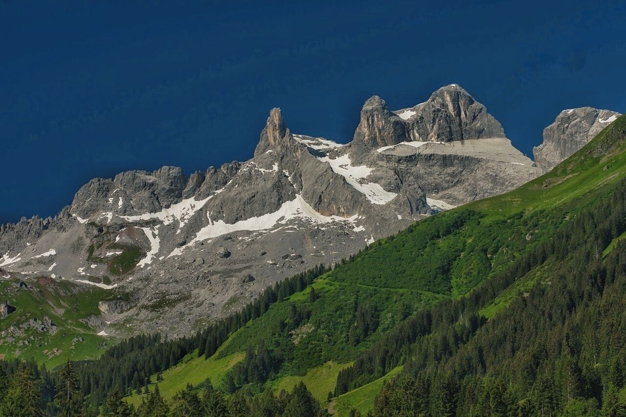 July 2016

Drei Tuerme, Raetikon, Vorarlberg land,  Austria 

Raetikon is a small mountain range on the border of Austria and Switzerland and  contains both the whitegrey peaks of limestone as well as the darkgreybrown ranges made of granite. This combined with vast green meadows filled with colourful flowers in the beggining of summer.
If you ascend the Raetikon from Gauertal valley (villages of Tschaggung or Latschau) you can enjoy spectacular views of the probably most beautiful part of Raetikon, which is the Drei Tuerme (ie. Three Towers) massif with the spikes of Kleiner Turm (2.756 m, on the left), Mittel Turm (2.815 m) and Grosser Turm (2.830 m). You can summit these from the bellow located Lindauer Huette cabin in few hours.