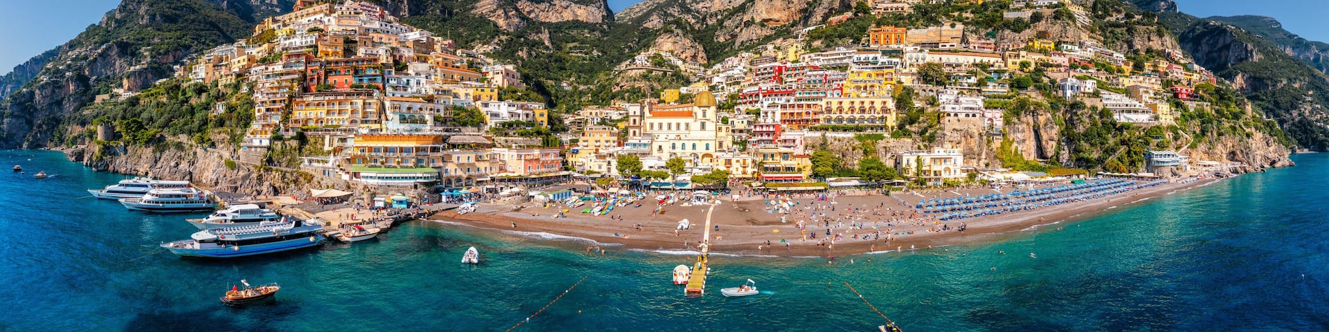 Aerial view of Positano with comfortable beach and blue sea on Amalfi Coast in Campania, Italy. Positano village on the Amalfi Coast, Salerno, Campania. Beautiful Positano, Amalfi Coast in Campania.