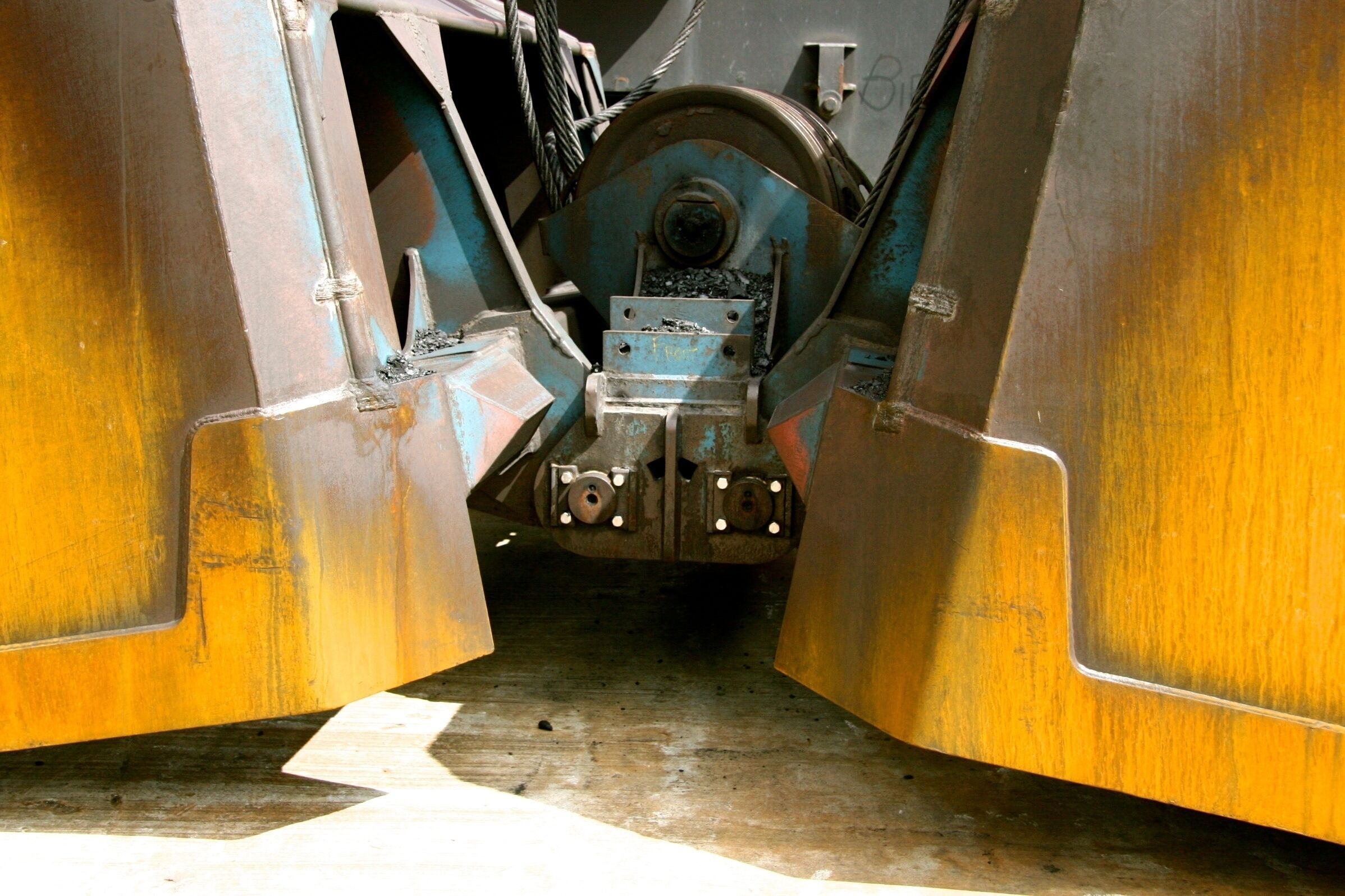 I was on the first cruise ship to ever dock by Foynes, Ireland. The entire town came down to the shoreline to wave to us as we 
came by. It felt like a movie moment, very special.

I took this photo in the boatyard just after we got off the ship. I liked the way that zooming in on the machinery with its rust stains, chipping paint, and various shapes made it look abstract. 

We had a great day exploring Foynes, and I still remember the people there as some of the nicest I've ever met traveling.

#golden