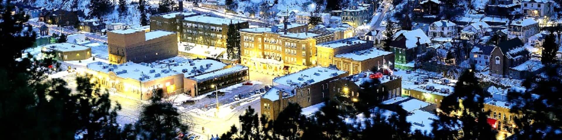 Deadwood which includes snow, night scenes and a small town or village